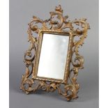 A Victorian pierced gilt metal rococo style easel frame fitted a mirror (slight chip to base) 28cm x