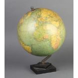A Philips 9" terrestrial globe raised on a square black Bakelite base Some very minor damage to