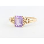 A 9ct yellow gold emerald cut amethyst cocktail ring, size S, 2.5 grams