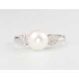 A 9ct white gold pearl and diamond ring, size M 1/2, 2.6 grams