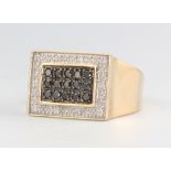 A gentleman's 9ct yellow gold white and black diamond rectangular ring, 4.5 grams, size V