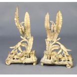 A pair of 19th Century French gilt metal fire dogs with floral decoration 46cm h x 26cm w x 8cm d