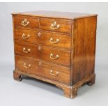 A Georgian oak chest of 2 short and 3 long drawers with brass swan neck drop handles, raised on