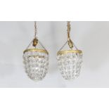 A pair of circular bag shaped light fittings hung lozenges 19cm x 15cm