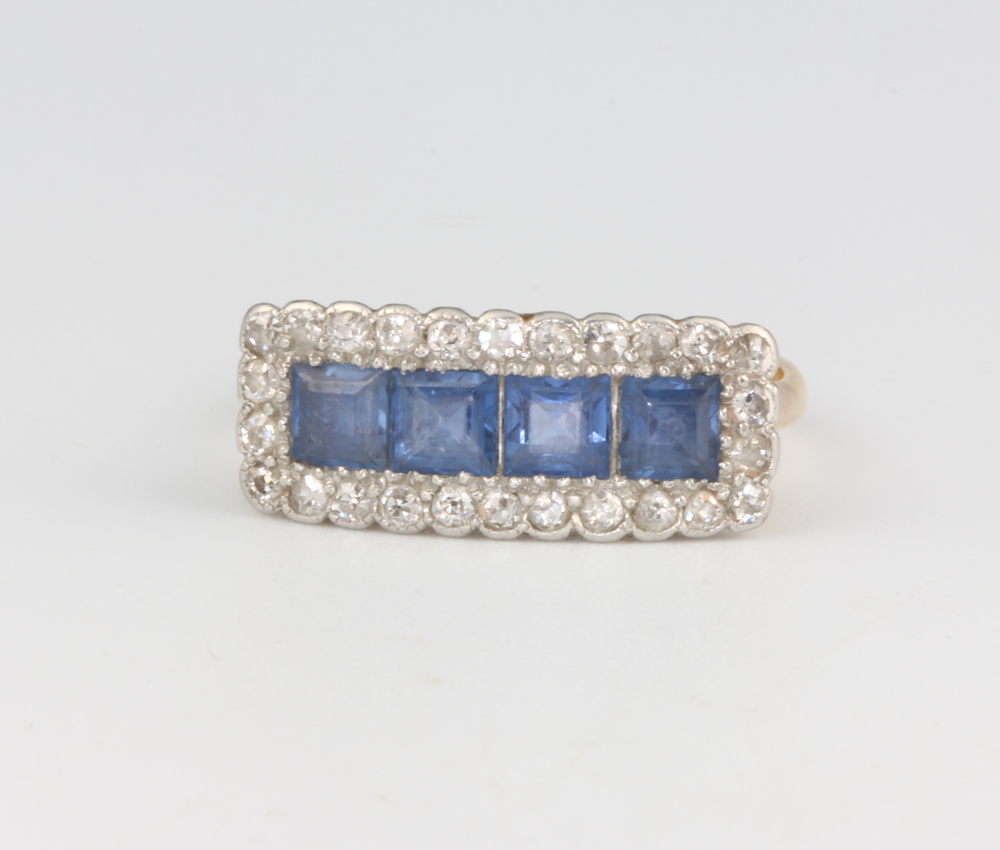 An Edwardian 18ct yellow gold sapphire and diamond cocktail ring with 4 princess cut sapphires