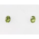 A pair of silver peridot ear studs