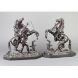 After Coustou, a pair of 19th Century bronze figures of Marley horses, raised on lozenge shaped