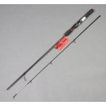 A Shakespeare Ugly Stik carbon fibre 2 piece 6' spinning fishing rod