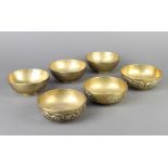 Six 19th Century Chinese polished gilt metal dishes decorated with dragons 4cm x 11cm