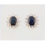 A pair of 9ct yellow gold oval sapphire and diamond ear studs, centre stones approx. 3.85ct,