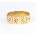 A 9ct yellow gold bright cut wedding band, size Q, 5.3 grams