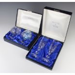 A pair of cut glass brandies and a pair of cut glass champagne flutes boxed, by Mappin & Webb