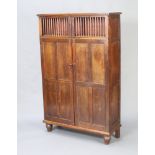 An 18th Century Continental oak food cabinet with shelved interior enclosed by a panelled and