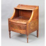 A Georgian mahogany bow front commode with hinged lid raised on turned supports 76cm h x 55cm w x