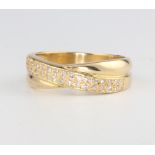 An 18ct yellow gold crossover diamond ring 5.6 grams, size P