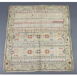 A George III woolwork sampler with upper and lower case letters and motto by Francis Holmes, age 11,