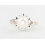 A 10ct white gold cultured pearl and diamond ring, 2.1 grams, size J