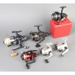 K P Morritts Intrepid Elite fishing reel contained in a black plastic case, a Power Carp reel, a