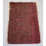 A red ground Bokhara rug with 6 octagons within a multi row border 140cm x 87cm Frayed to the edge