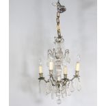 A gilt metal and cut glass 4 light electrolier hung lozenges 56cm h x 35cm w,