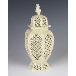 A 19th Century creamware reticulated hexagonal vase and cover with geometric decoration 24cm The