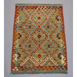 A yellow and turquoise ground Chobi Kilim with all over geometric design 120cm x 81cm