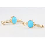 A pair of yellow gold turquoise brooches 3.2 grams