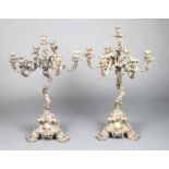 A pair of Victorian ex plated 7 light rococo candelabra 70cmI arm is broken