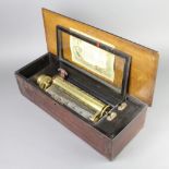A Victorian cylinder musical box playing 12 aires and with 27cm cylinder contained in an inlaid
