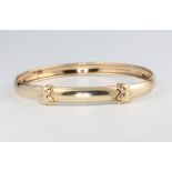 A childs 9ct yellow gold bangle, 2.9 grams