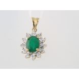 A 9ct yellow gold oval emerald and diamond pendant, the centre stone approx. 1.85ct, the brilliant