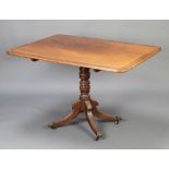 A Georgian rectangular, crossbanded mahogany snap top breakfast table, raised on a turned column and