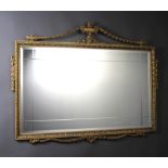 A Georgian style rectangular bevelled plate and cut glass mirror contained in a gilt frame