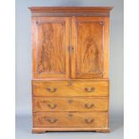 A Georgian mahogany linen press secretaire, the upper section with moulded and dentil cornice, blind