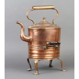 A Victorian oval copper kettle raised on a twin handled hot plate stand with turned ebony handles
