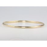 A 9ct yellow gold bangle 7.9 grams