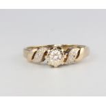 A 9ct yellow gold diamond ring, size K, 2.1 grams