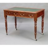 A Victorian mahogany writing table with inset writing surface above 2 long drawers with brass swan