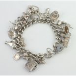 A silver charm bracelet 96.2 grams
