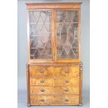 A Georgian mahogany secretaire bookcase, the upper section with moulded cornice, interior fitted