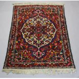 A blue and red ground Persian Bakhtiari rug with central medallion 220cm x 155cm
