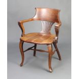 An Edwardian mahogany slat and tub back office chair with solid seat, on cabriole supports with H