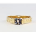 An 18ct yellow gold bark finish sapphire and diamond ring 3.9 grams, size M 1/2