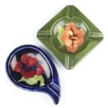 A Moorcroft pear shaped ashtray decorated flowers 16cm and a green ground square ditto 12cm