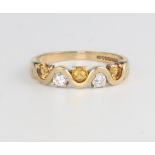 A 9ct yellow gold diamond and citrine ring, the 2 brilliant cut diamonds 0.20ct, the 3 brilliant cut