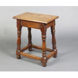 A late Victorian oak 17th Century style joined stool, raised on turned and block supports 52cm h x
