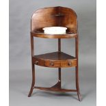 A Georgian mahogany corner wash stand with 3/4 gallery, 3 bowl receptacles, undertier fitted a