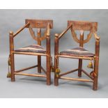 A pair of 19th Century carved oak Turners chairs with solid seats raised on turned supports 1 has an