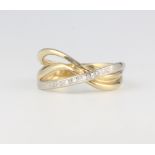 A 14ct 2 colour gold and diamond crossover ring 3.5 grams, size N 1/2