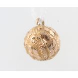 A 9ct yellow gold ball charm 1.2 grams, 10mm